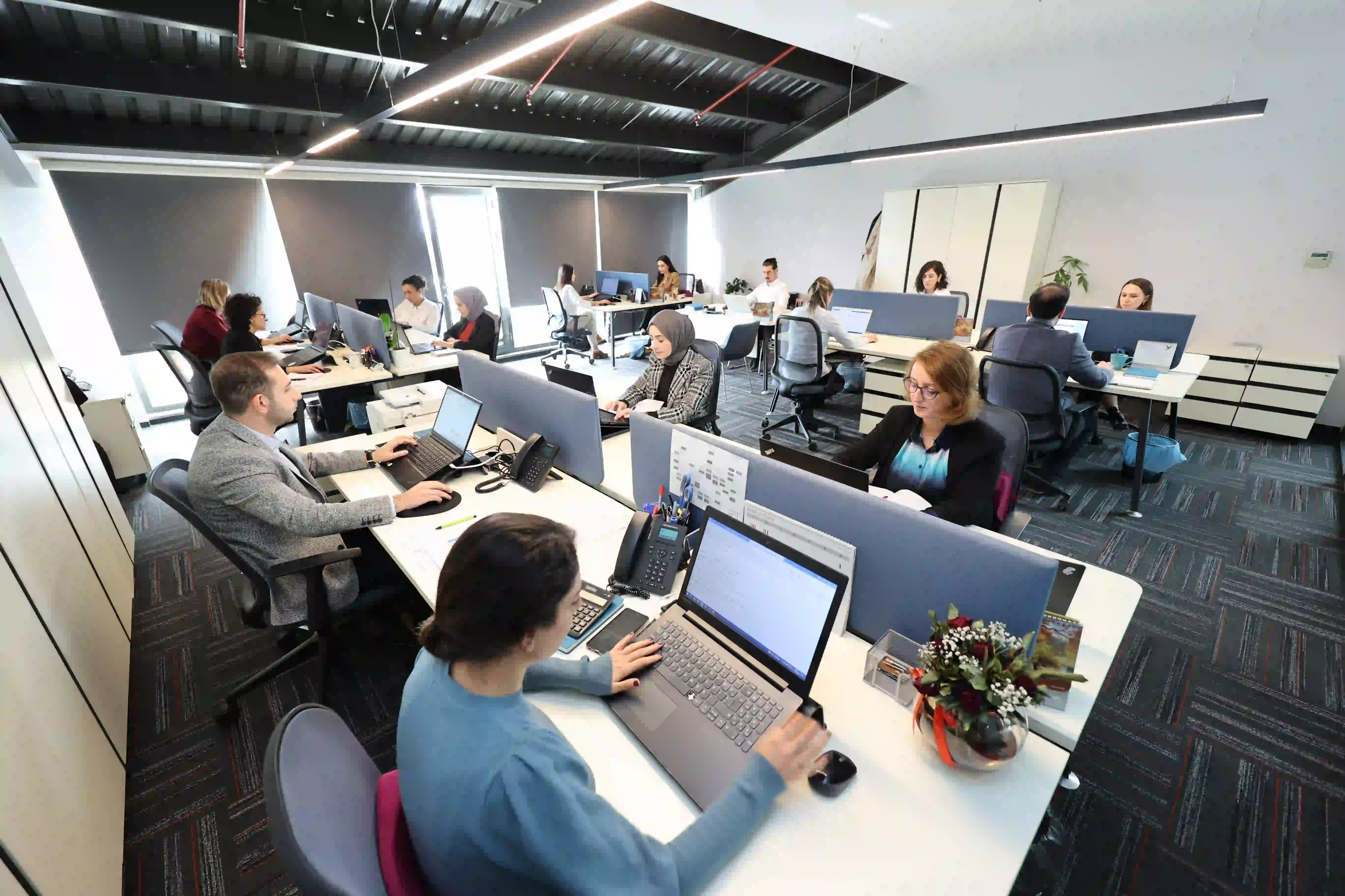 Yiğitoğlu's technical support team working in an office, providing high-quality service to clients.